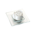 Rose blossom scented stone on a transparent glass plate